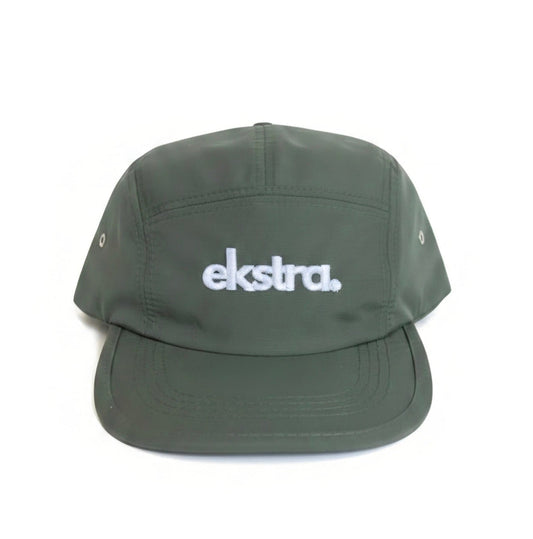 An olive green 5-panel cap with the word 'ekstra.' embroidered in white on the front, shown against a plain white background.